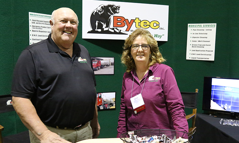 Steve and Mona with trade show booth.